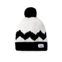 A top down photo showing the black and white Stitch & Story's Peanut Charlie Brown beanie, with a Peanuts woven label hand sewn to the front of the black knitting beanie brim.