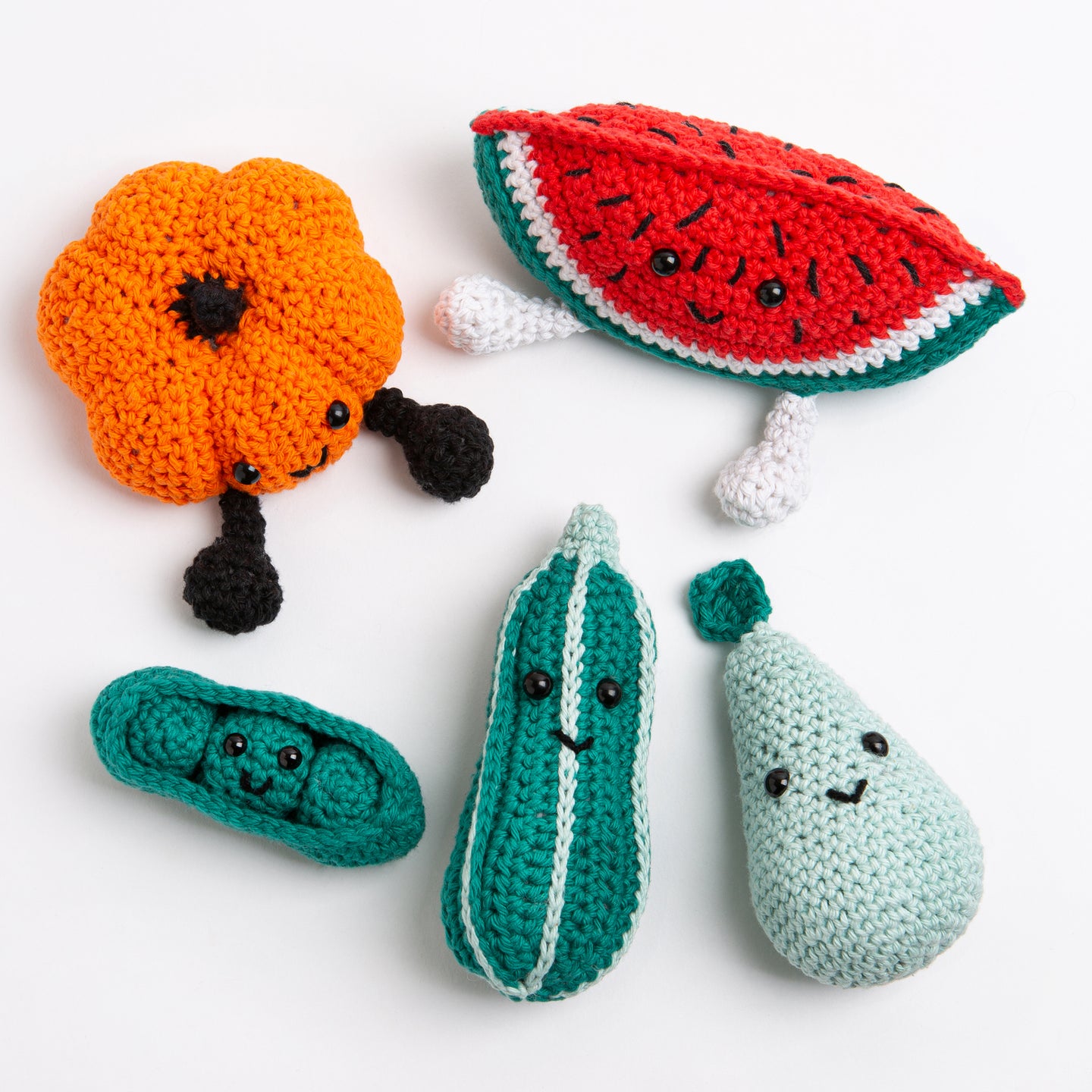 A collection photo showing Perry the Pear in Pale Blue, Penelope Pea in a Pod in Forest Green, Melany the Watermelon in Red Apple, Paul the Pumpkin in Deep Orange and Courtney the Courgette in Forest Green, all with a welcoming smiling face on a white background