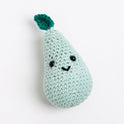 A pear toy made with Stitch & Story Cotton One in Pale Blue has a joyful smiley faces, with a small Forest Green leaf at the top, on a white background