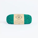 Front on photo of the Stitch & story's Cotton one yarn in 25g ball, in Forest Green
