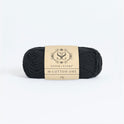 Front on photo of the Stitch & story's Cotton one yarn in 25g ball, in Obsidian Black