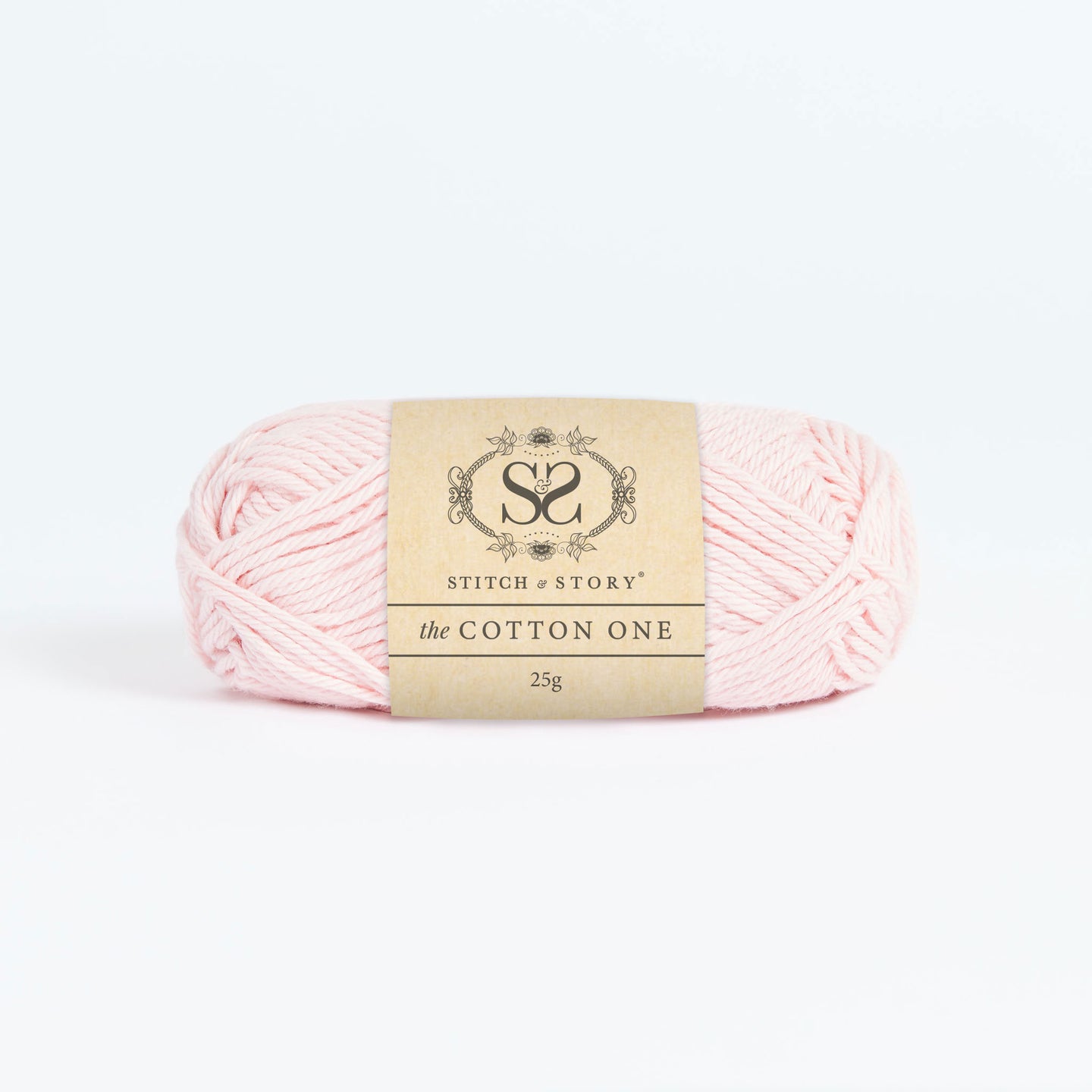 Front on photo of the Stitch & story's Cotton one yarn in 25g ball, in Baby Pink