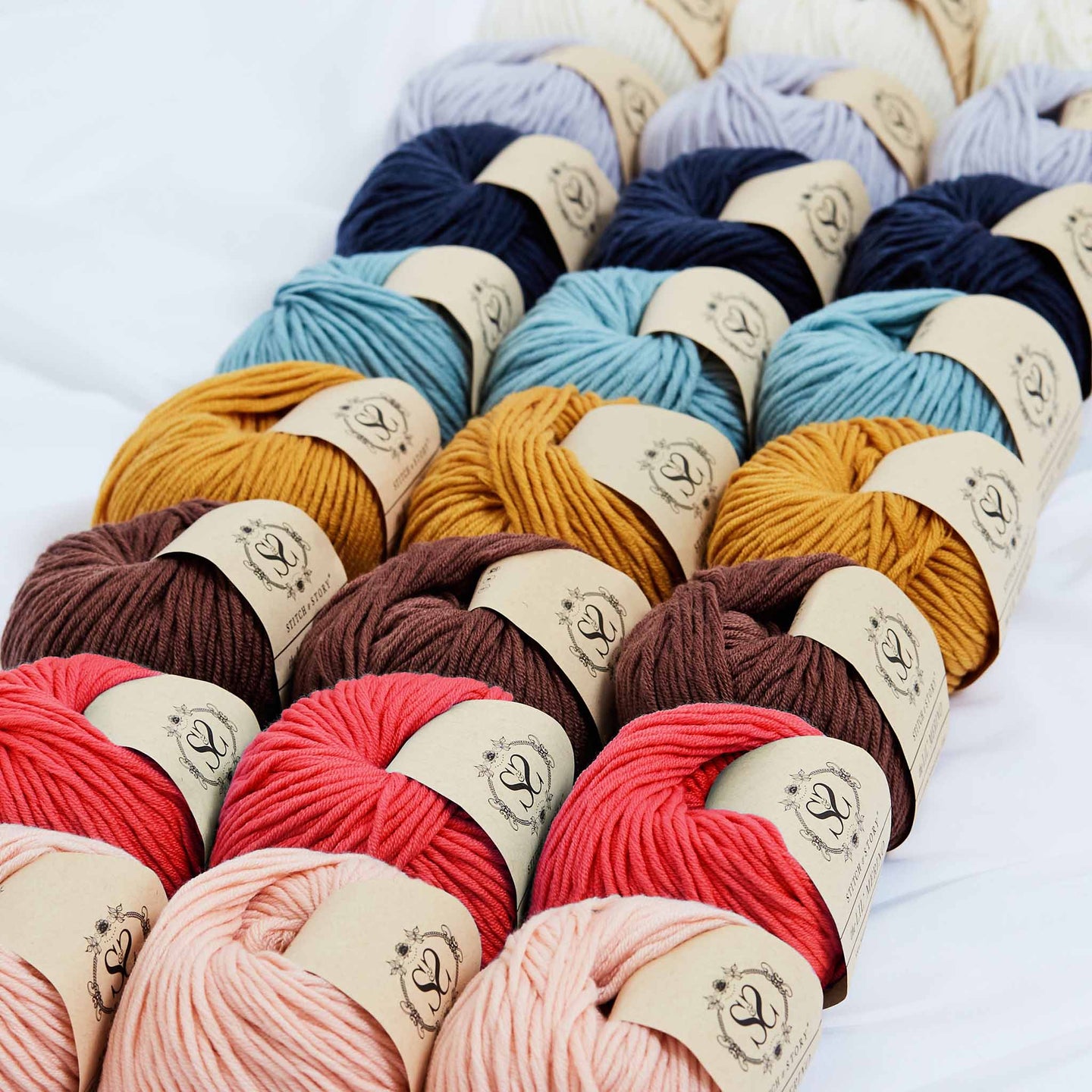 Stitch & story's lil' Merino 100% merino wool yarn is lined up in 3s, in their own colours.