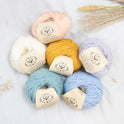 Overhead shot to show soft pastel colours of Lil' Merino from Stitch & Story.