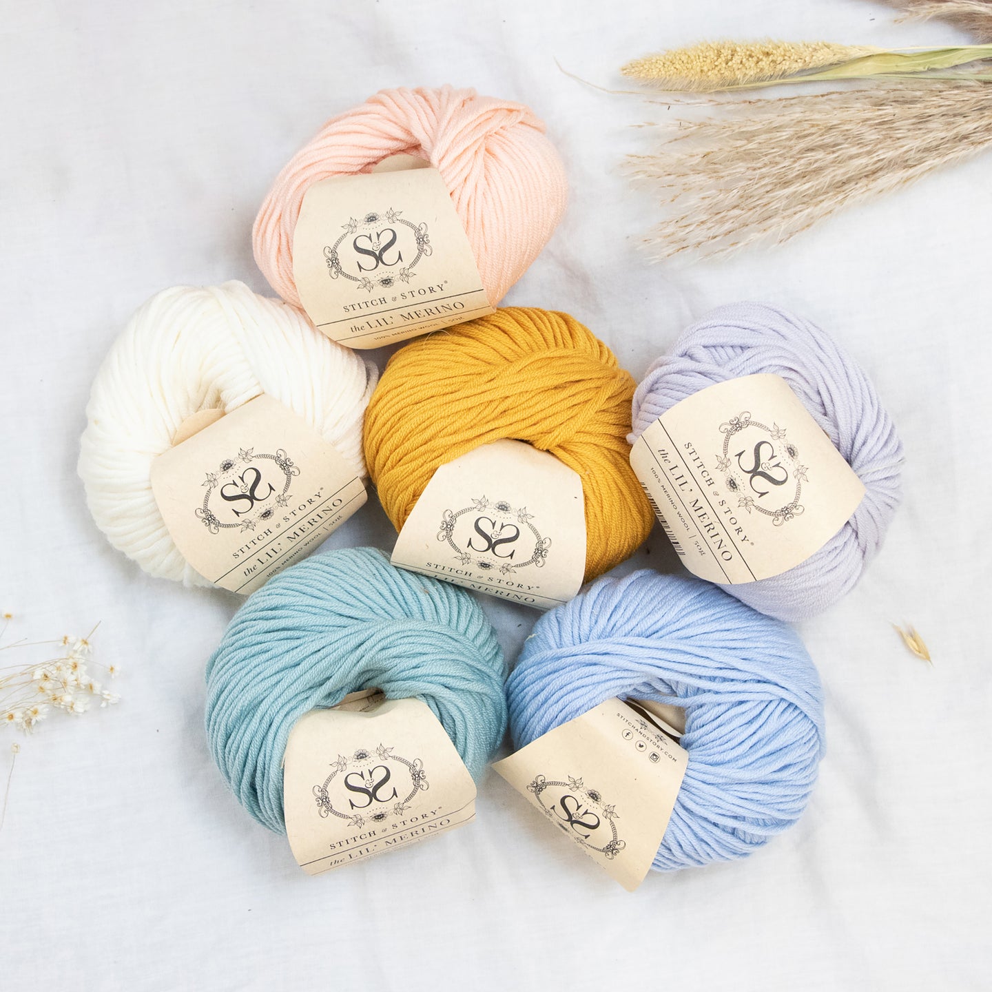 Overhead shot to show soft pastel colours of Lil' Merino from Stitch & Story.