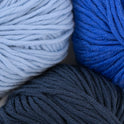 100% merino wool, Stitch & Story's Lil' Merino yarn in colour group, showing a close up of baby blue, royal blue and graphite blue