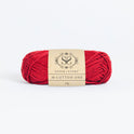 Front on photo of the Stitch & story's Cotton one yarn in 25g ball, in Red Apple