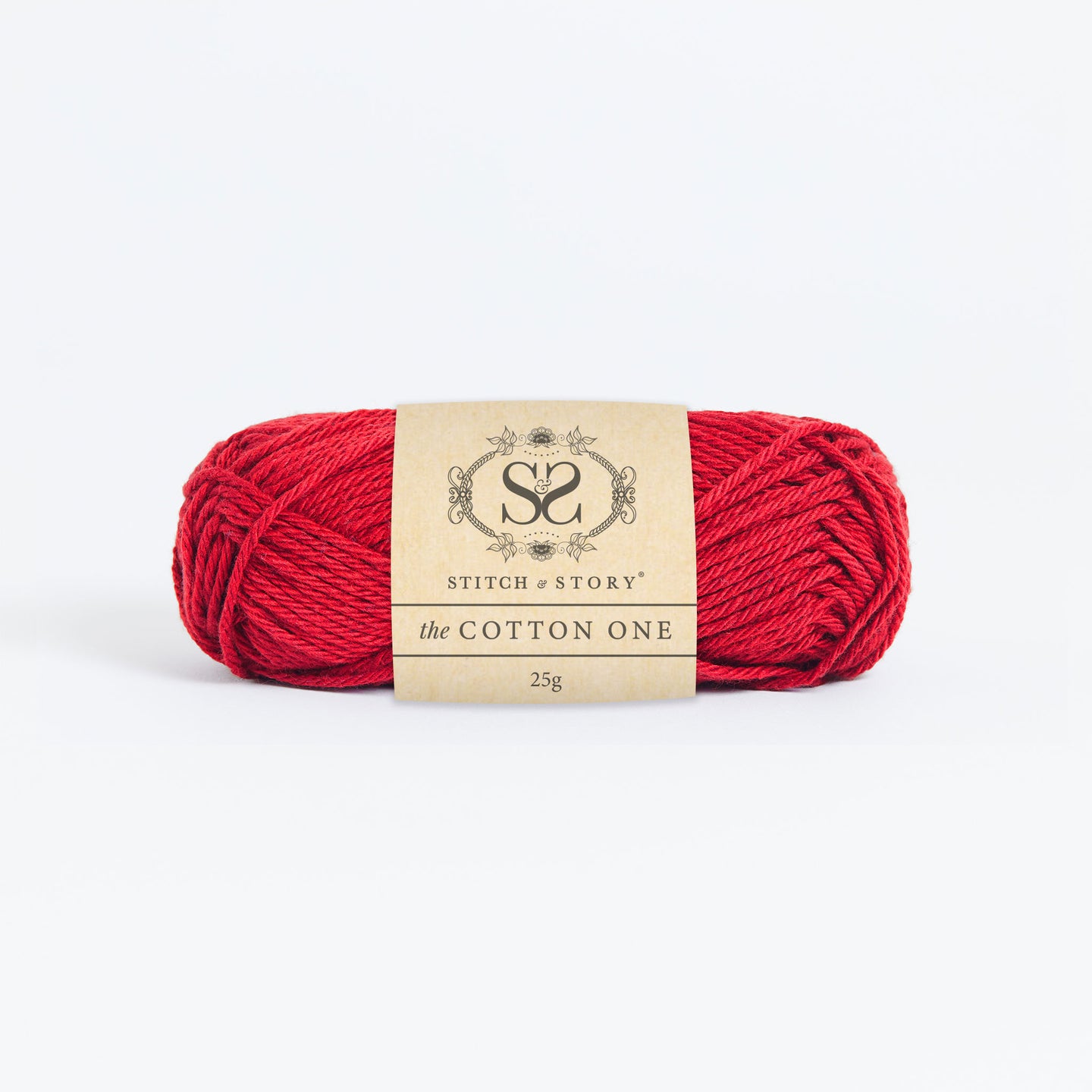 Front on photo of the Stitch & story's Cotton one yarn in 25g ball, in Red Apple
