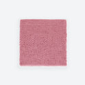 A Dust pink folded Bounty throw knitted from Stitch & Story beginner knitting kit in 100% merino wool The Chunky Wool.