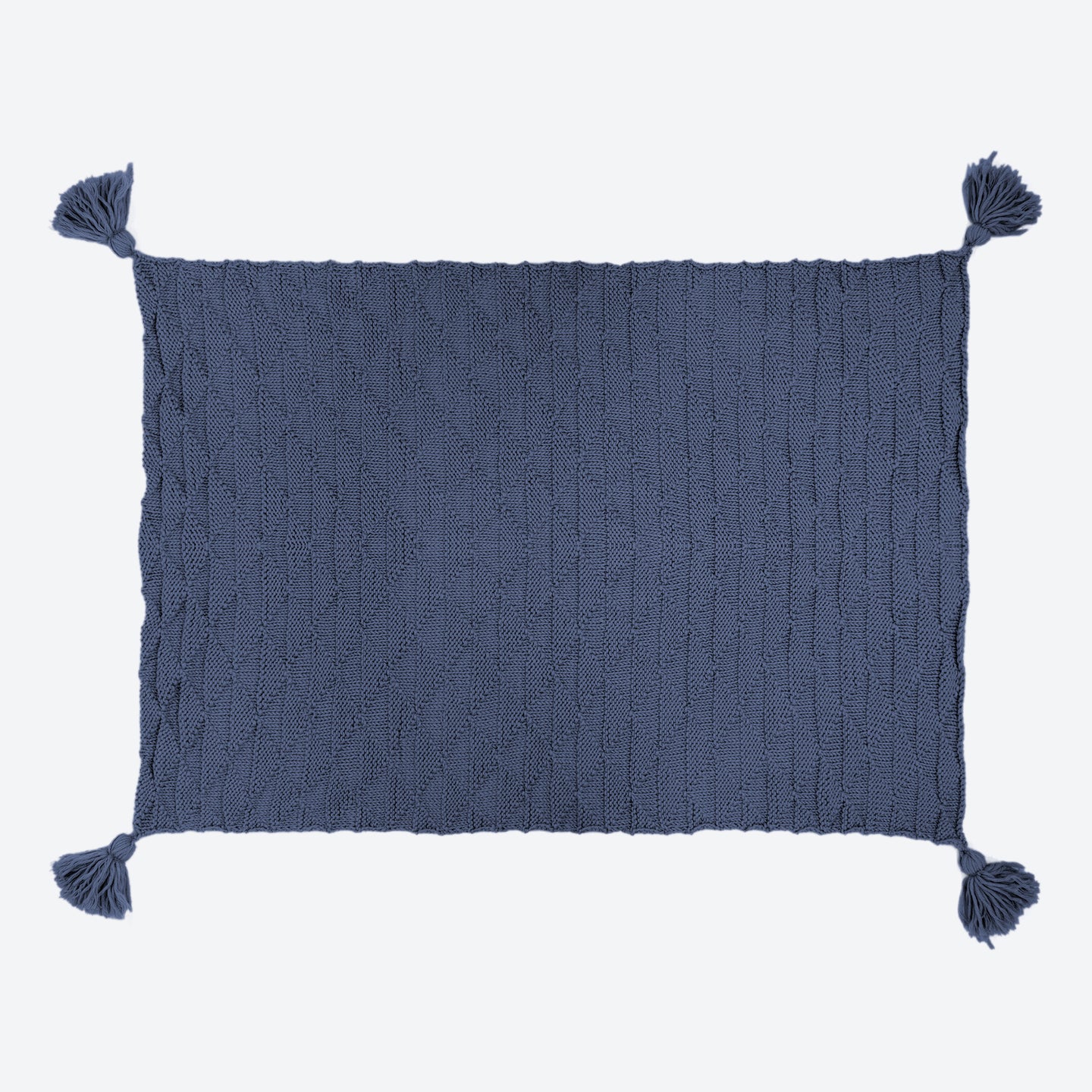A Graphite Blue ivy geometric blanket laid out, with all 4 corner tassels spread out.