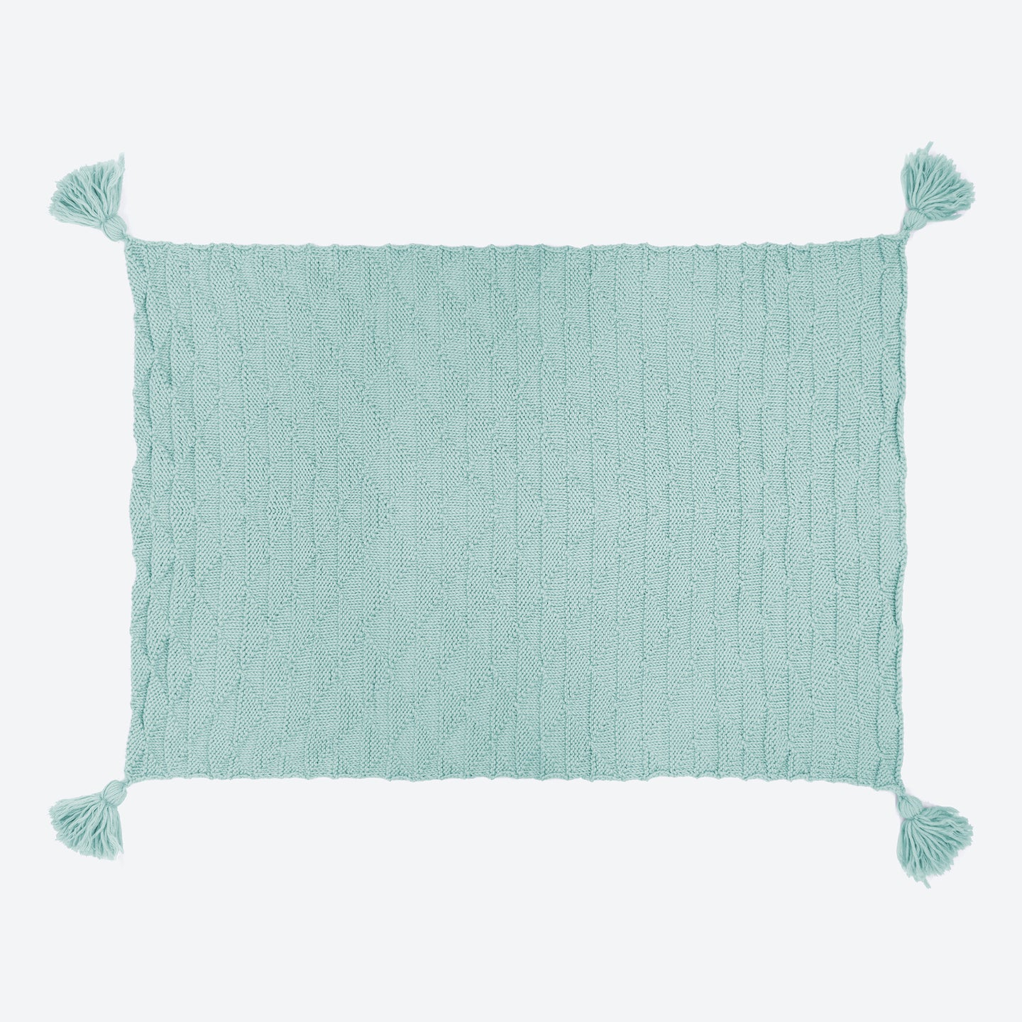 A soft teal ivy geometric blanket laid out, with all 4 corner tassels spread out.