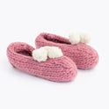 pink lola pom slippers with white pom pom knitted from Stitch & Story beginner knitting kit
