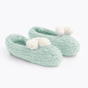 Iced Mint lola pom slippers with white pom pom knitted from Stitch & Story beginner knitting kit